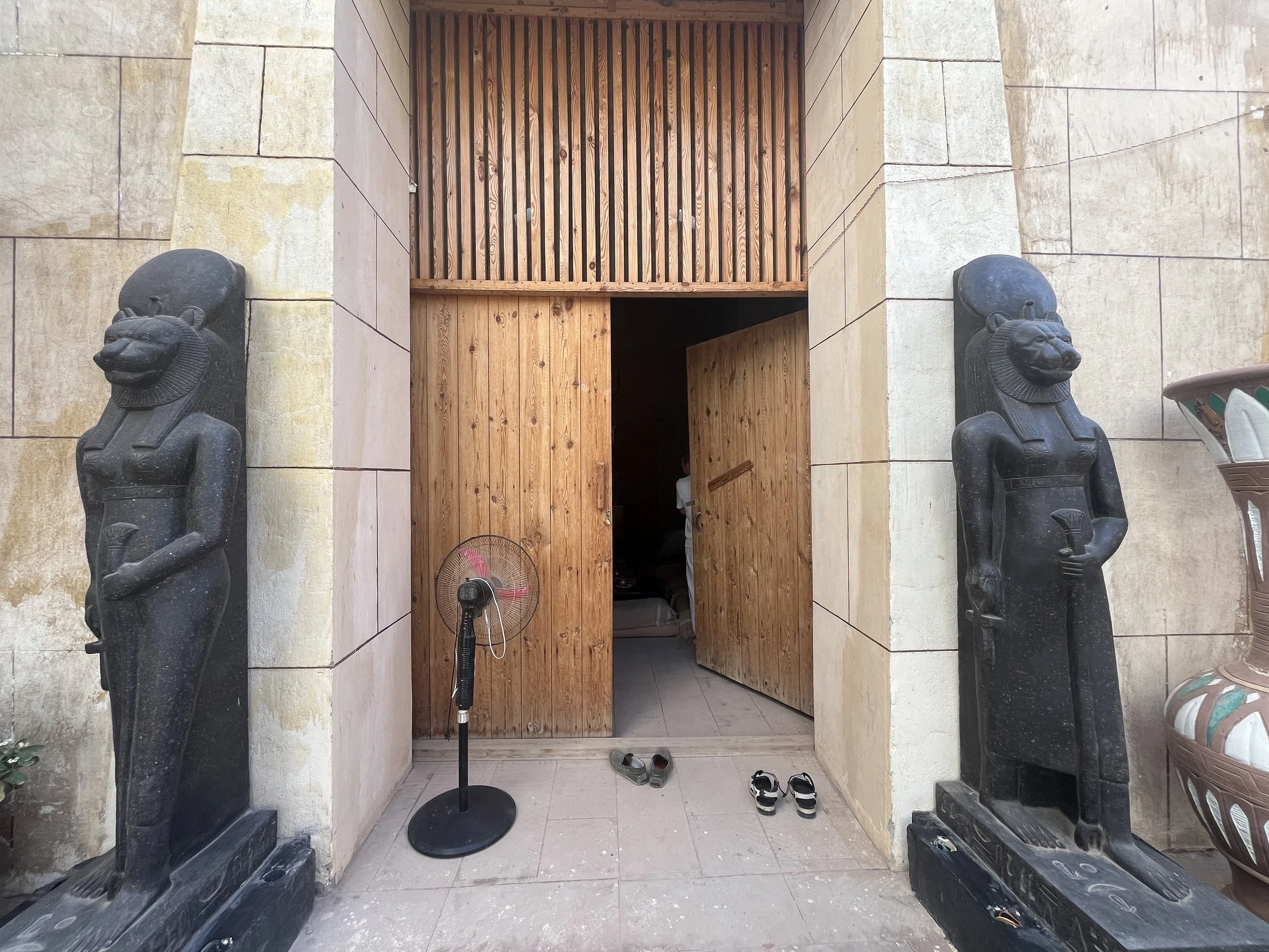 Sacred entrance to ceremony space at House of Life Abydos flanked by Sekhmet goddess statues