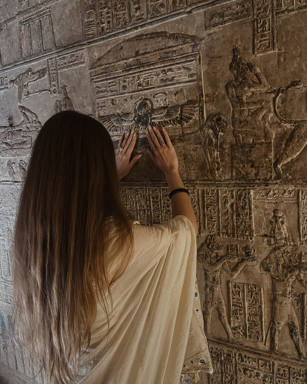 sabina-touching-ancient-egyptian-hieroglyphs-dendera-temple.png