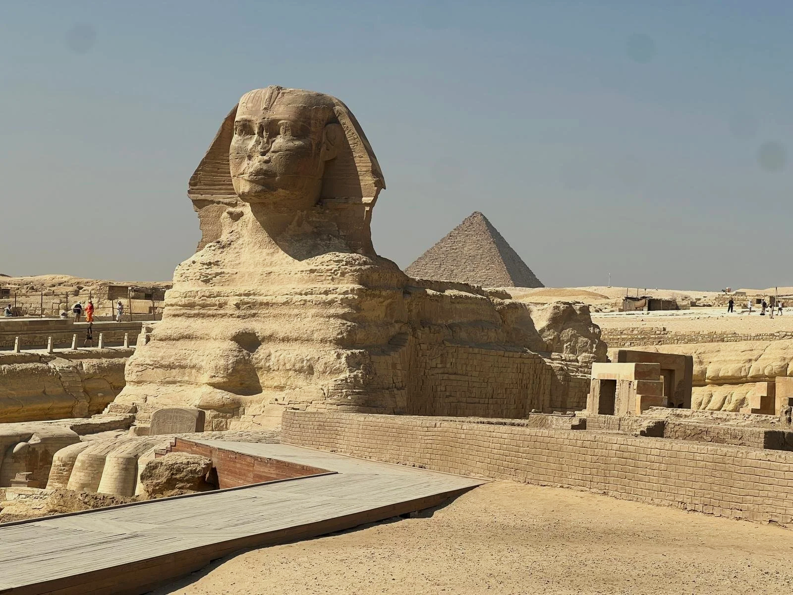 The Great Sphinx of Giza with the pyramid in the background during a sacred pilgrimage in Egypt.