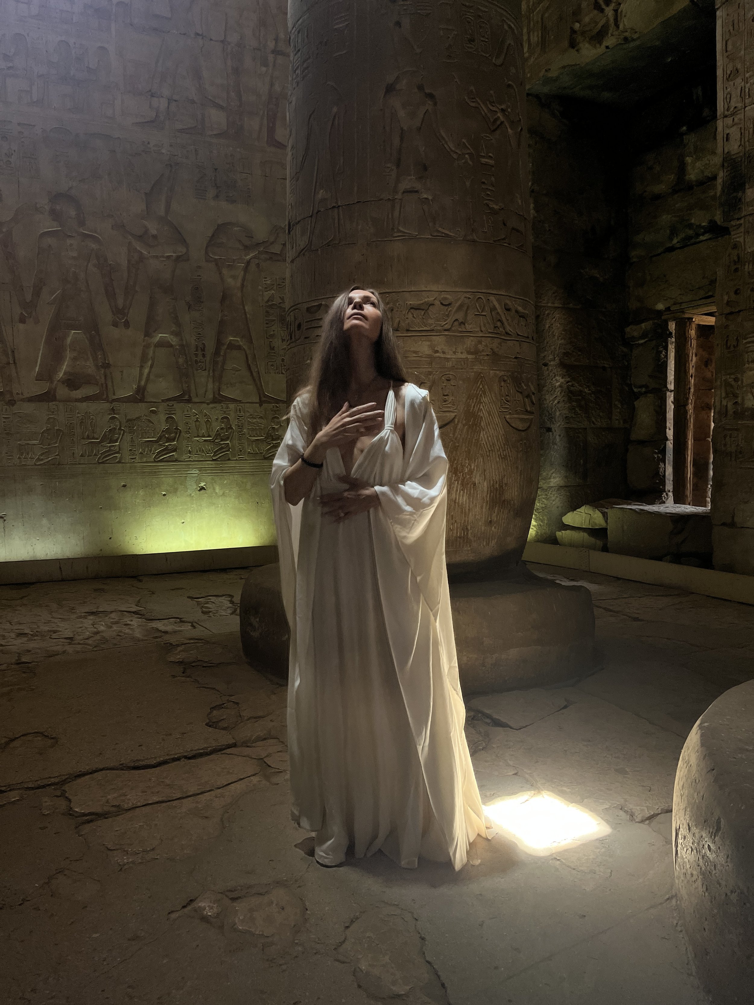 Sabina in sacred presence inside the Temple of Seti I at Abydos — ancient Egyptian healing site and spiritual pilgrimage