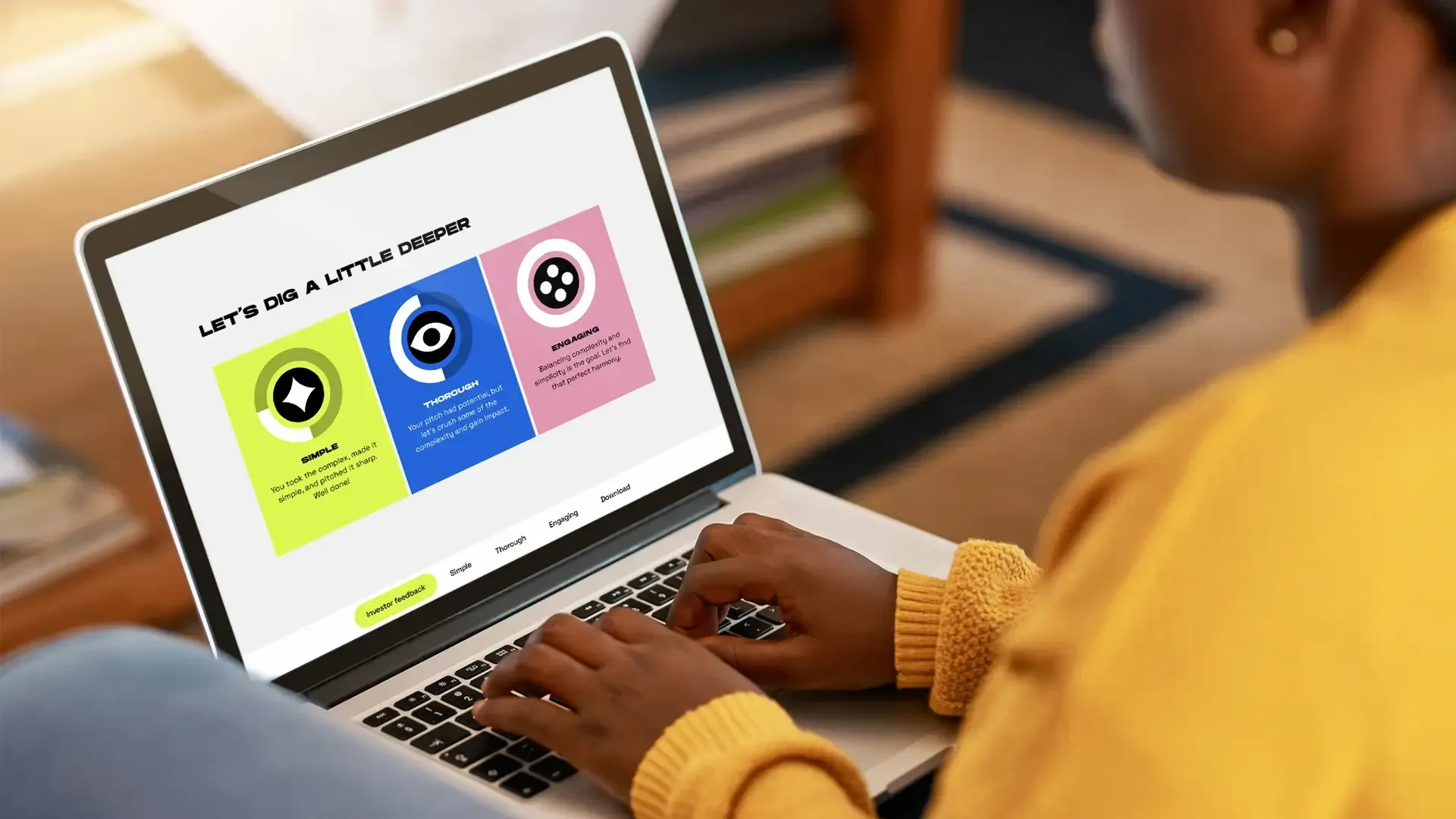 A person in a yellow sweater using a laptop with a presentation slide on the screen titled 'Let's Dig a Little Deeper.' The slide features three sections labeled 'Simple,' 'Thorough,' and 'Engaging,' each with icons and descriptions in different colors.