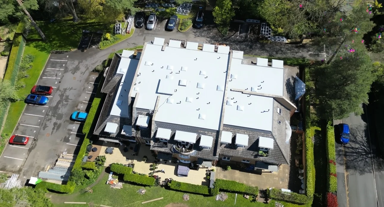Completed single-ply flat roof on a commercial building, aerial view