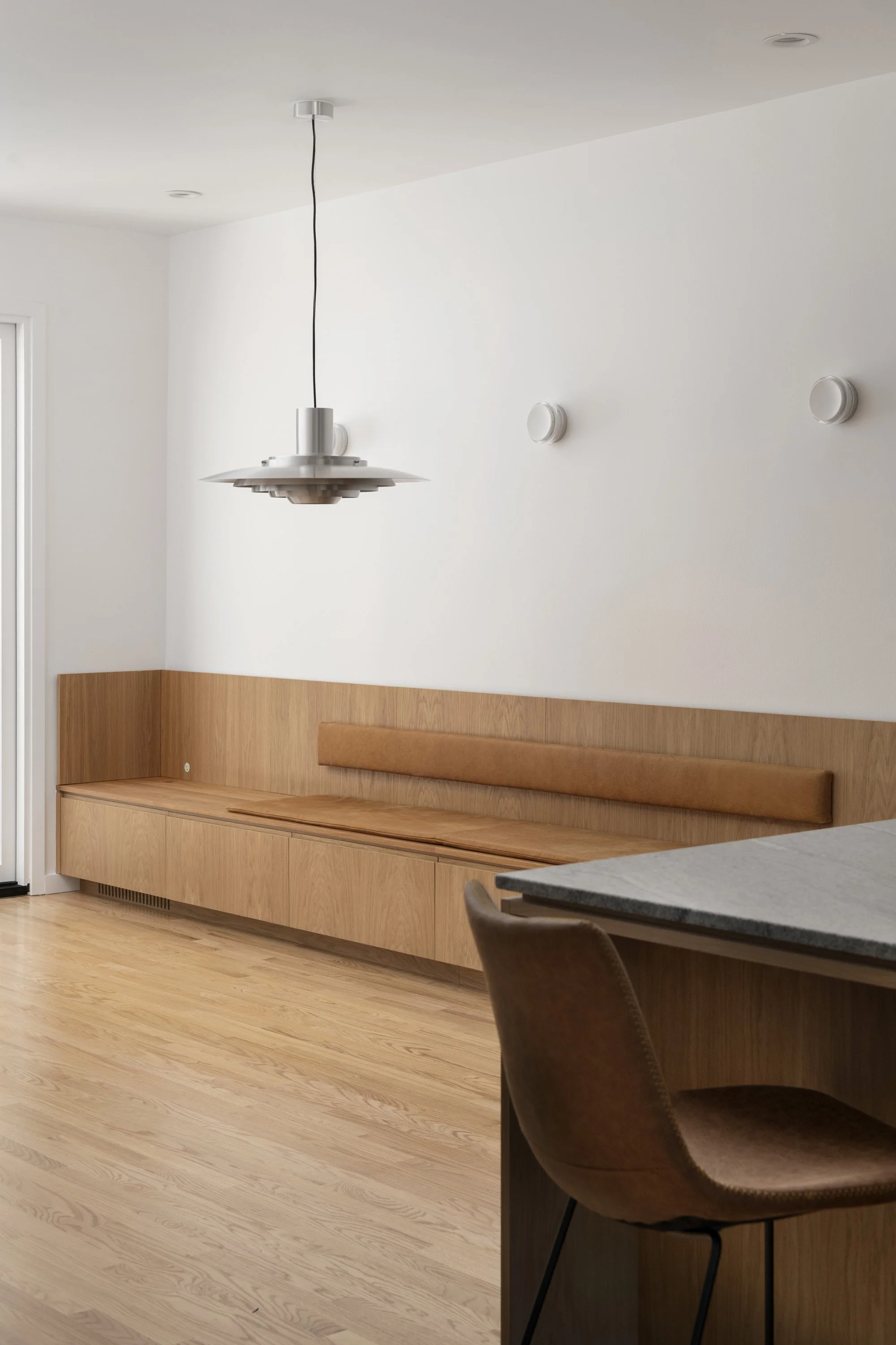 San Francisco kitchen renovation by YW Builders featuring expansive windows, abundant natural light, a built-in dining banquette, thoughtful details, and quality craftsmanship.