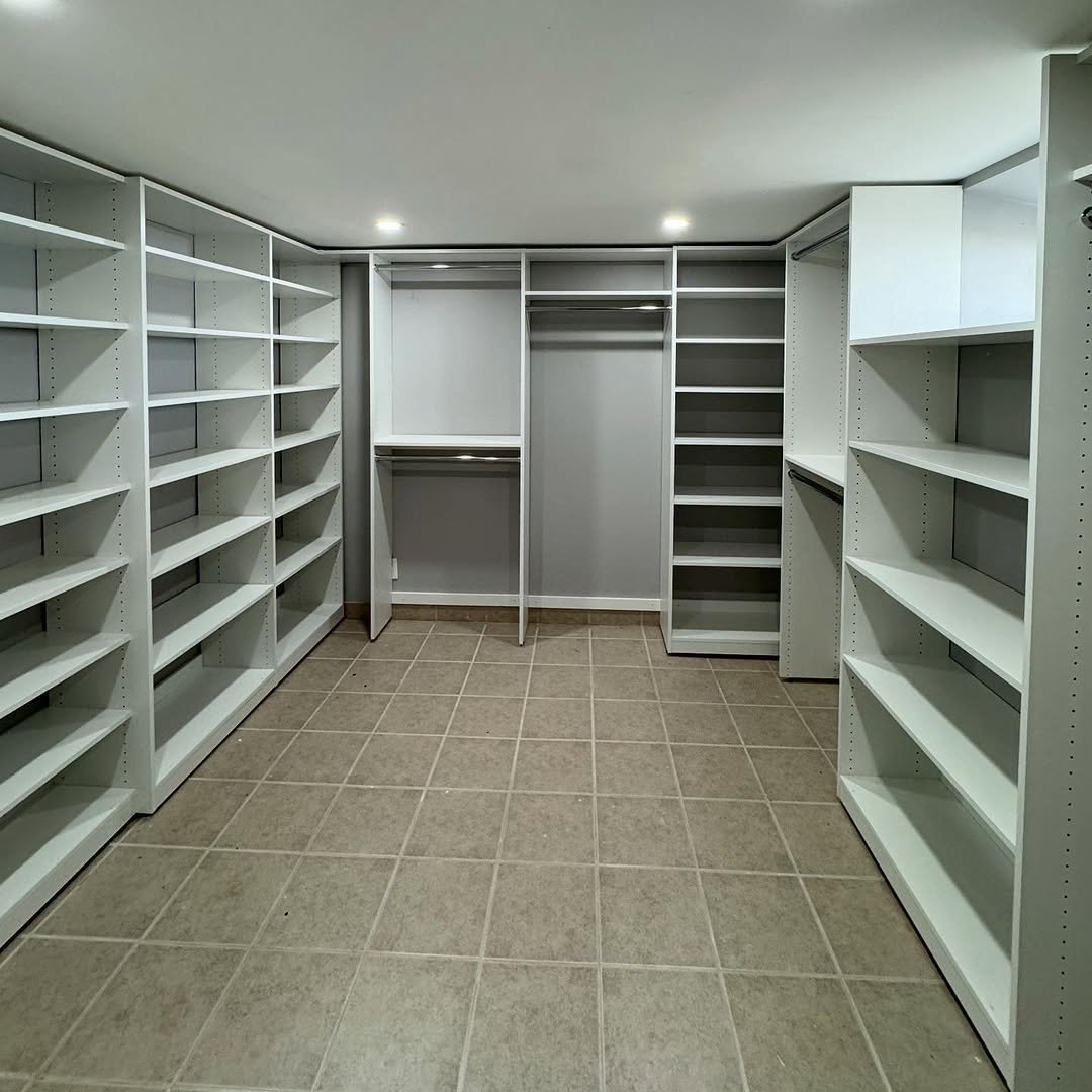 Custom walk-in closet with organized shelving and storage