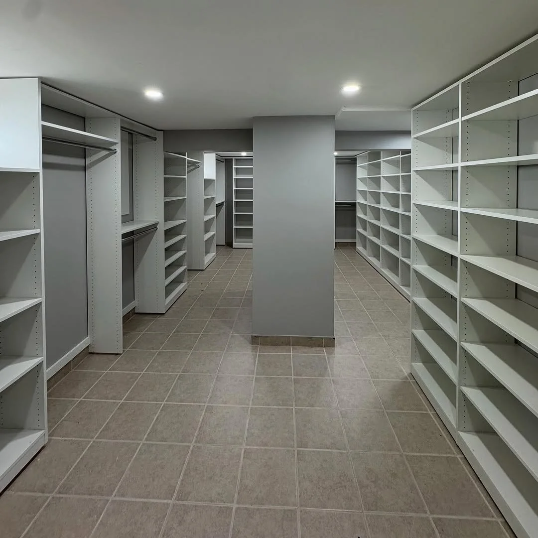 Large luxury walk-in closet with extensive custom storage