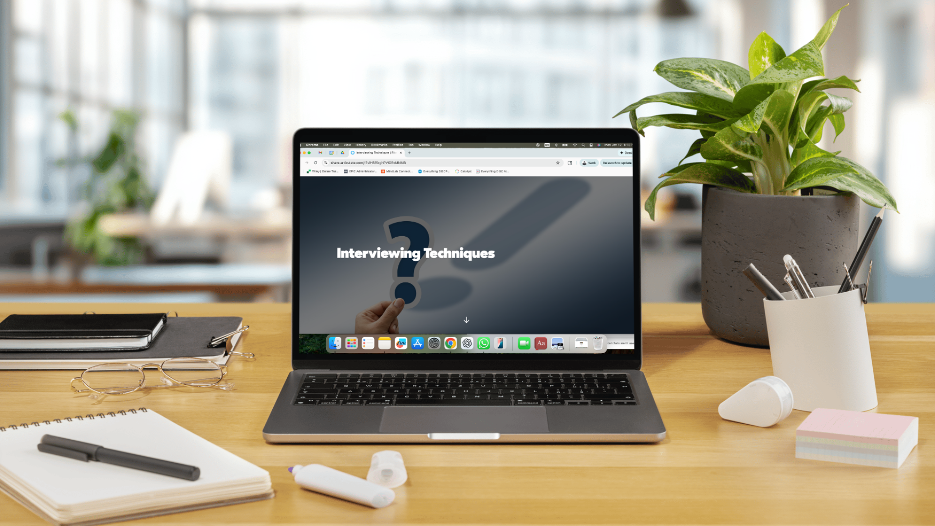 Laptop in a desk showing the cover page of course Interviewing Techniques