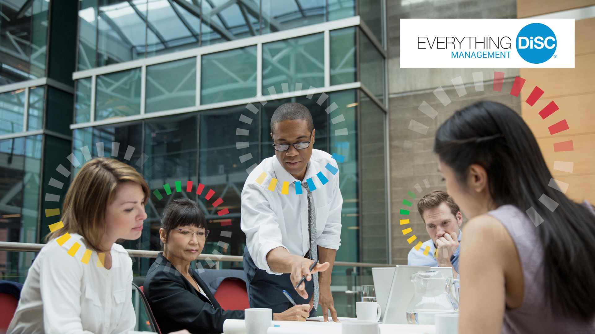 Business meeting in a modern office building with five professionals, including a man in a white shirt standing and gesturing, four seated women and men, some taking notes, surrounded by colored circular progress overlays.