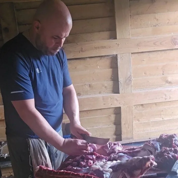 Butcher chopping meat
