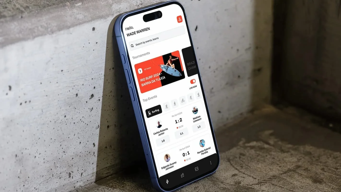 photo of a smartphone against a wall showing a sports app interface