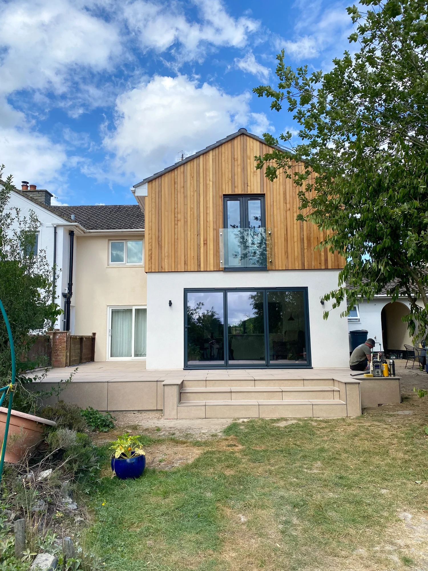 Two-story bespoke home extension with Western Red Cedar cladding and bi-fold doors by RC-Builders Devon