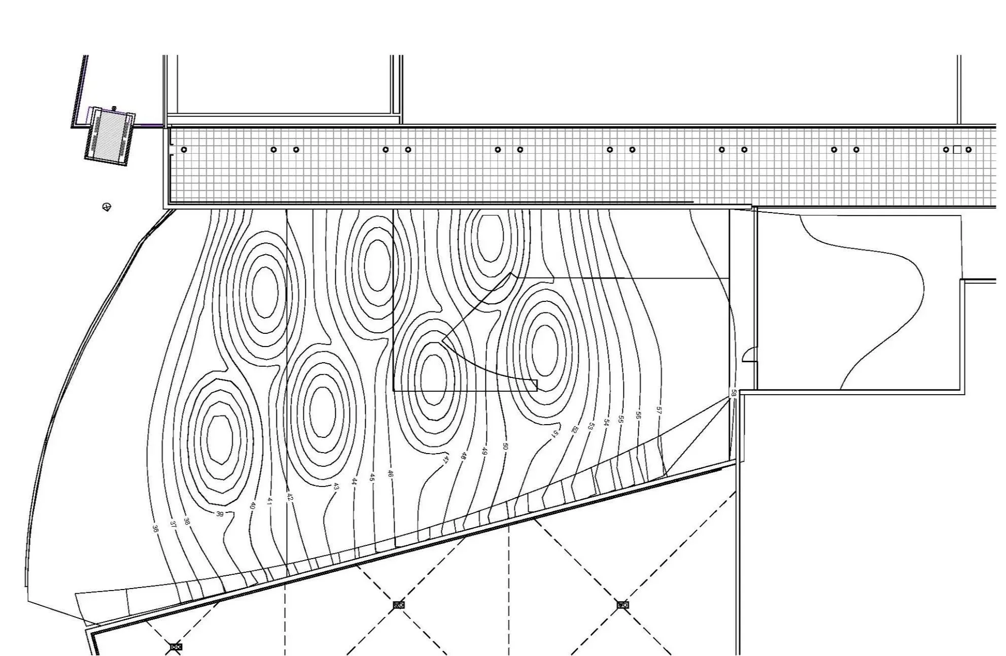Architectural site plan showing a long gridded structure, contour lines, elevation markings, and surrounding property boundaries.