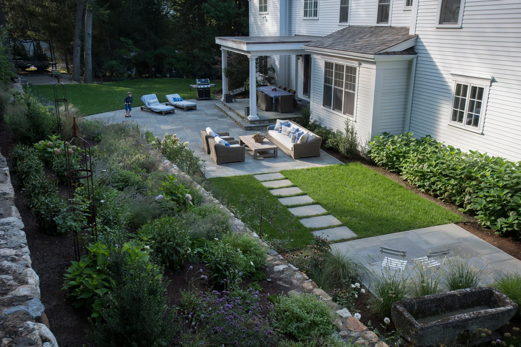 Private residence site photo - rear patios and landscape