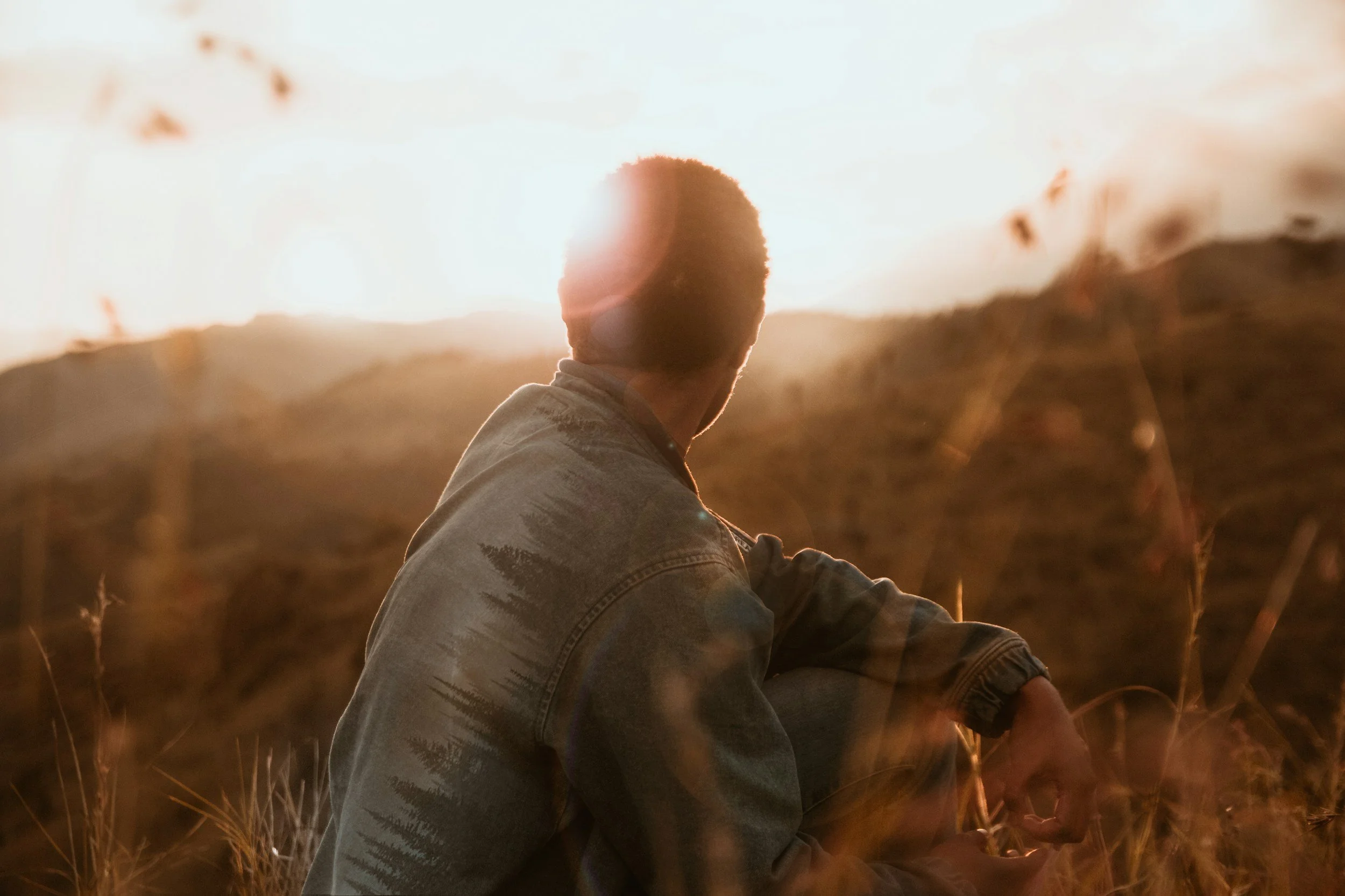 Man facing sunrise. Therapy in Mill Valley, support trauma healing, mindfulness therapy in Marin County