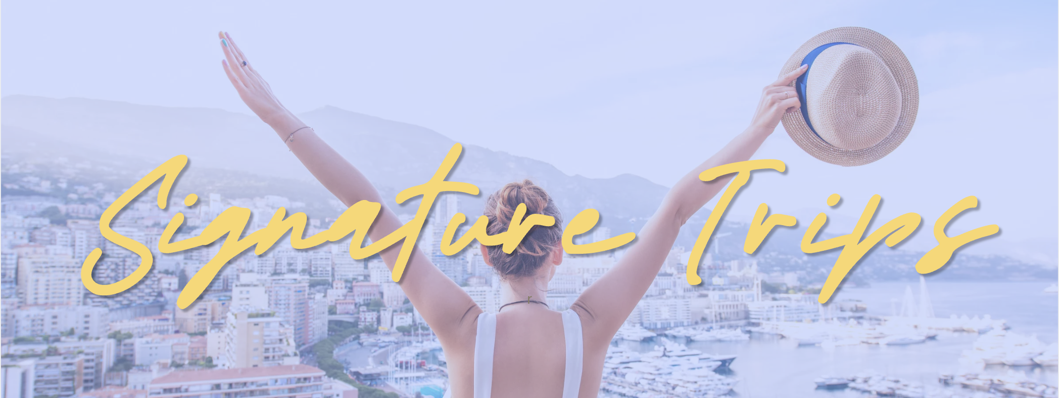 A woman on a rooftop overlooking a city, with mountains and water in the background, raising her arms with a straw hat in one hand, and the text 'Sanature Trips' written across the image in yellow cursive font.