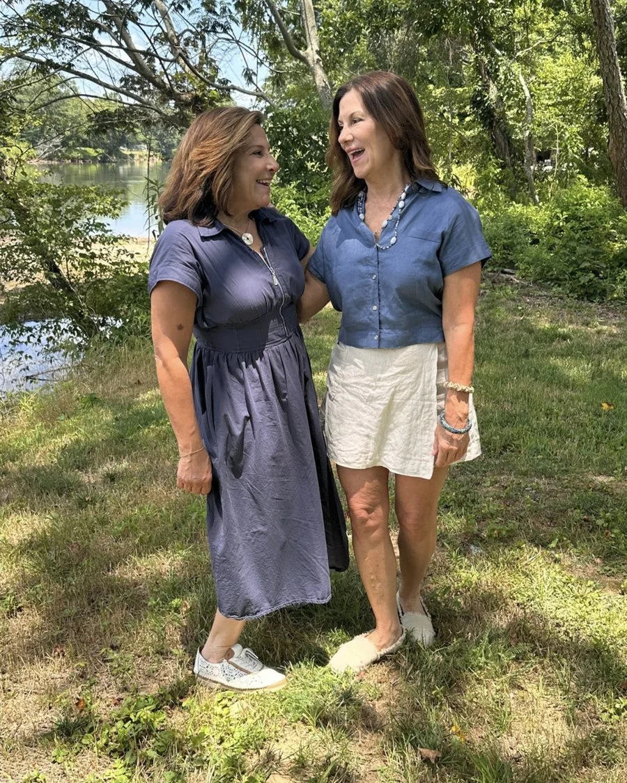 Heba and Elizabeth, hosts of Classical Egypt, laughing together outdoors