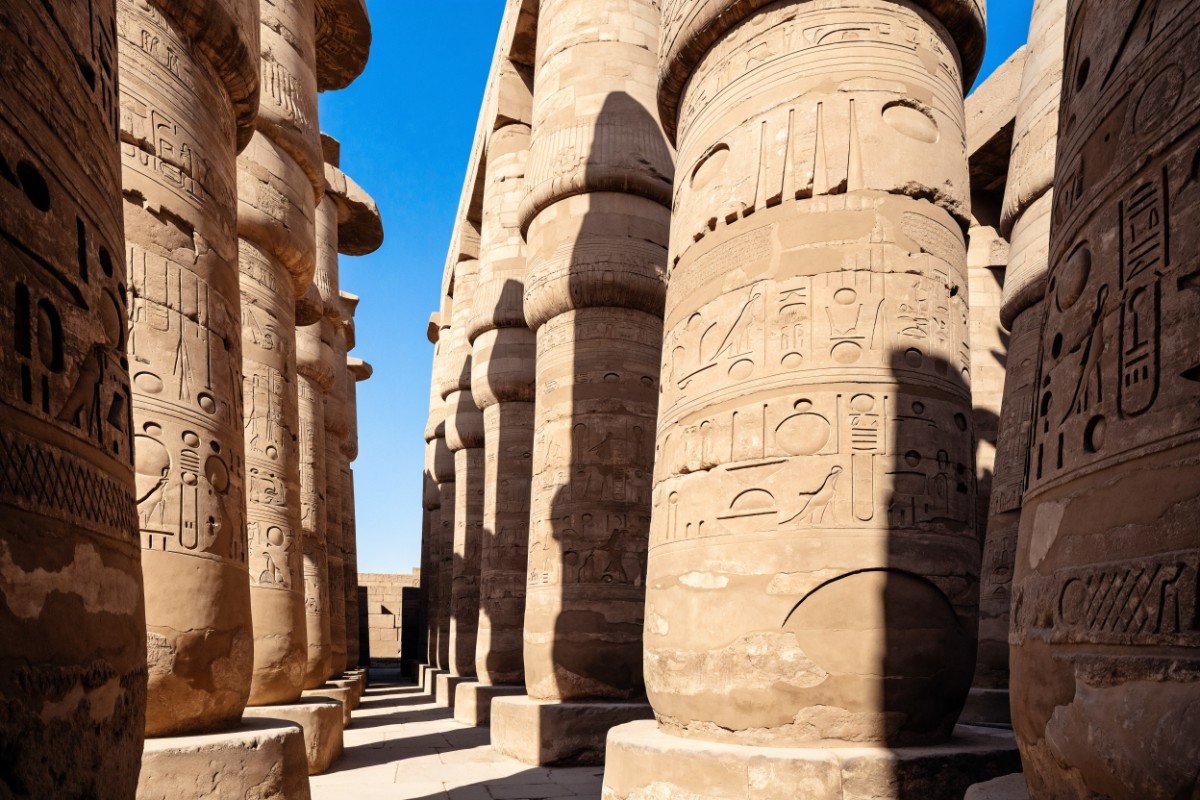 Carved sandstone columns of the hypostyle hall at Karnak temple in Luxor, Egypt