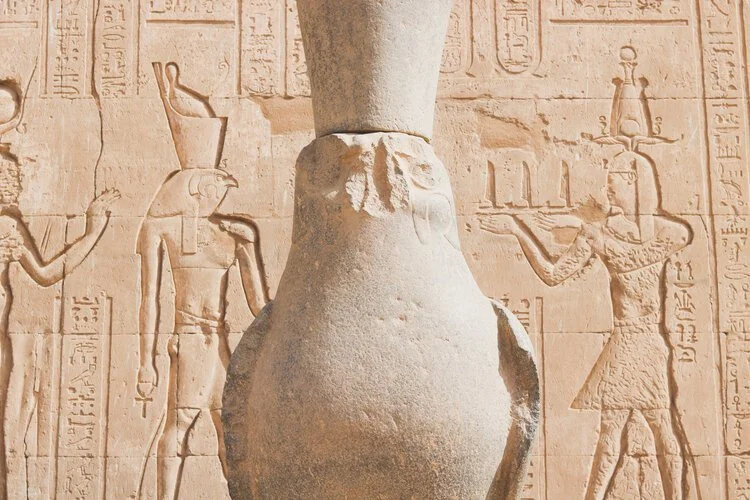 The falcon statue of Horus carved in stone at an ancient temple