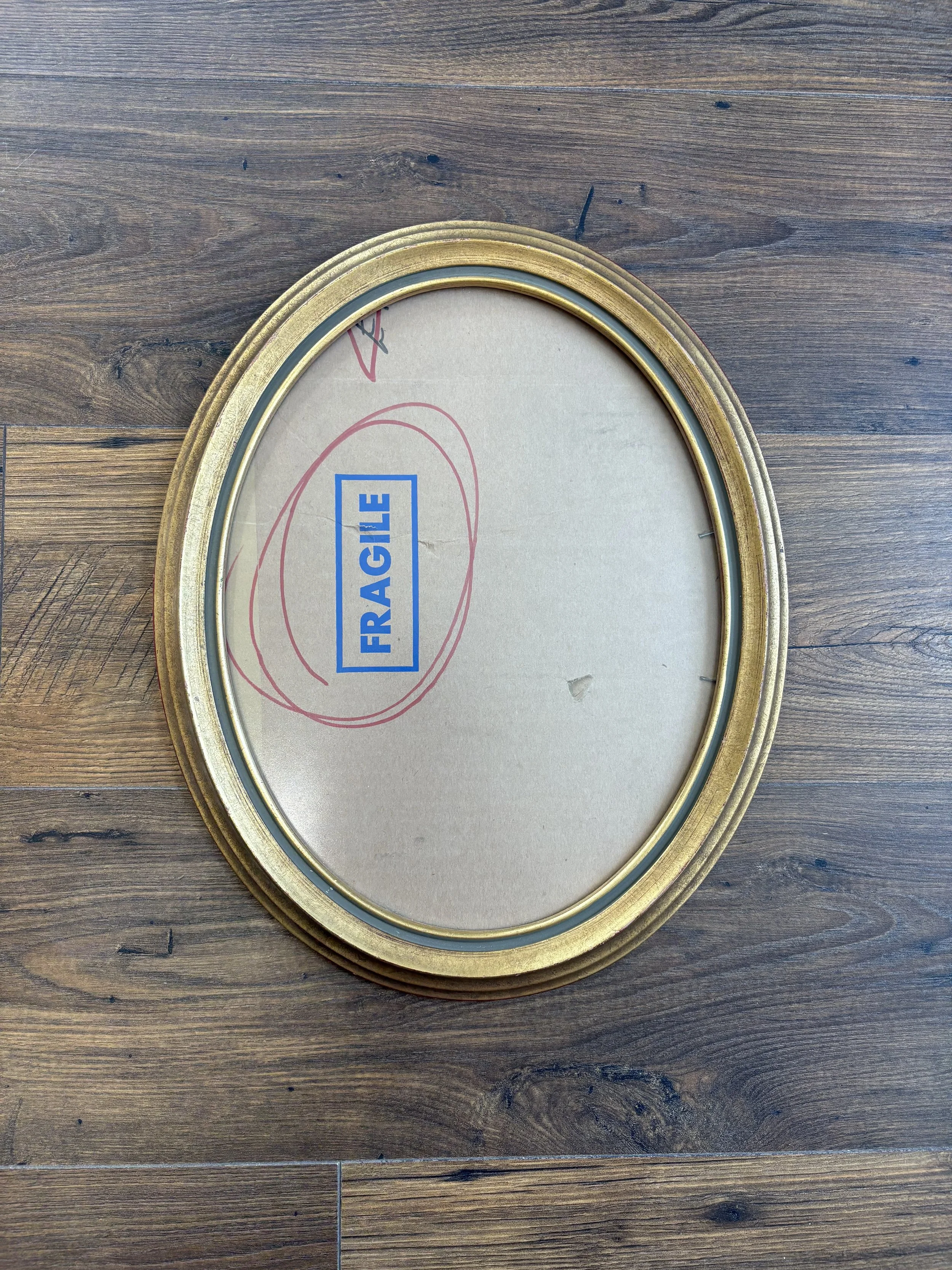 13.5”x10.5” gold oval frame