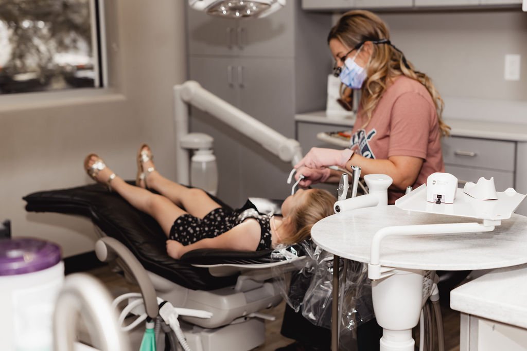 Dental Hygienist performing a cleaning at Mask Dental