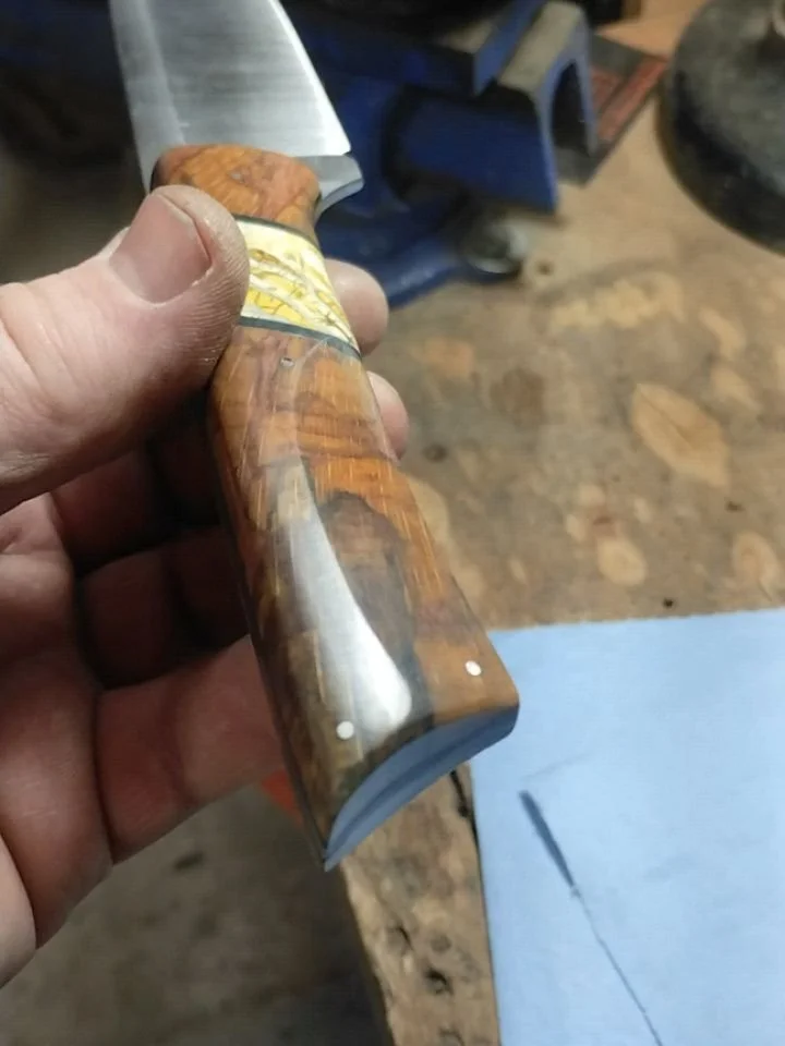 Wrapping up a couple of my Light Field Knives. Working the polish on the birch and mammoth. The other is a material I haven't used before, it's layered tan G10 and rubber. I'm quite impressed with the feel.

#custommade #custom #handle #handmade #out