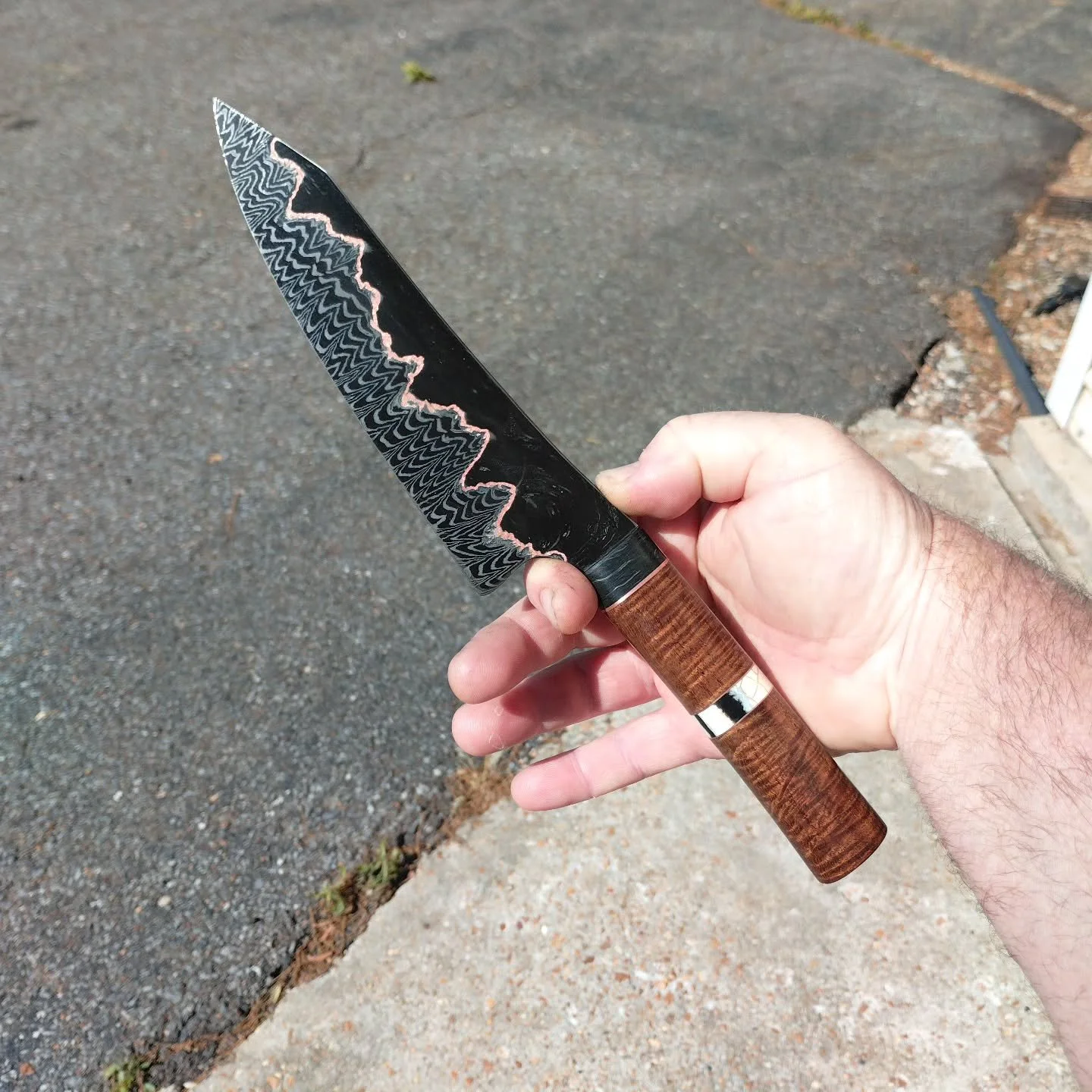 Putting the finishing touches on the latest chef knife. This billet from @devilleadam aka Deville Damascus is absolutely stunning. Available soon.....

#handmade #custom #chef #damascus #foodprep