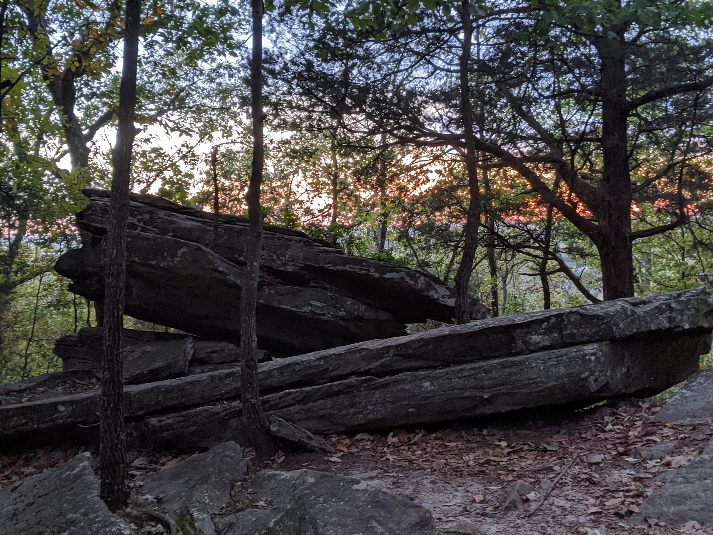 Rainbow Mountain large rocks stacked on top of each other overlooking a mountaintop viewother