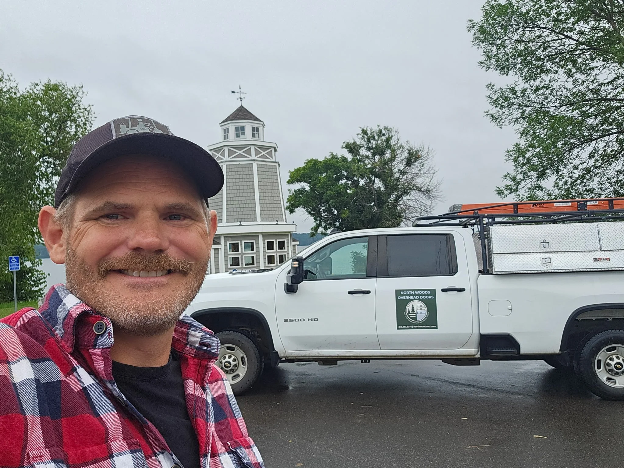 Jon from North Woods Overhead Doors standing in front of a company truck in Northern Minnesota