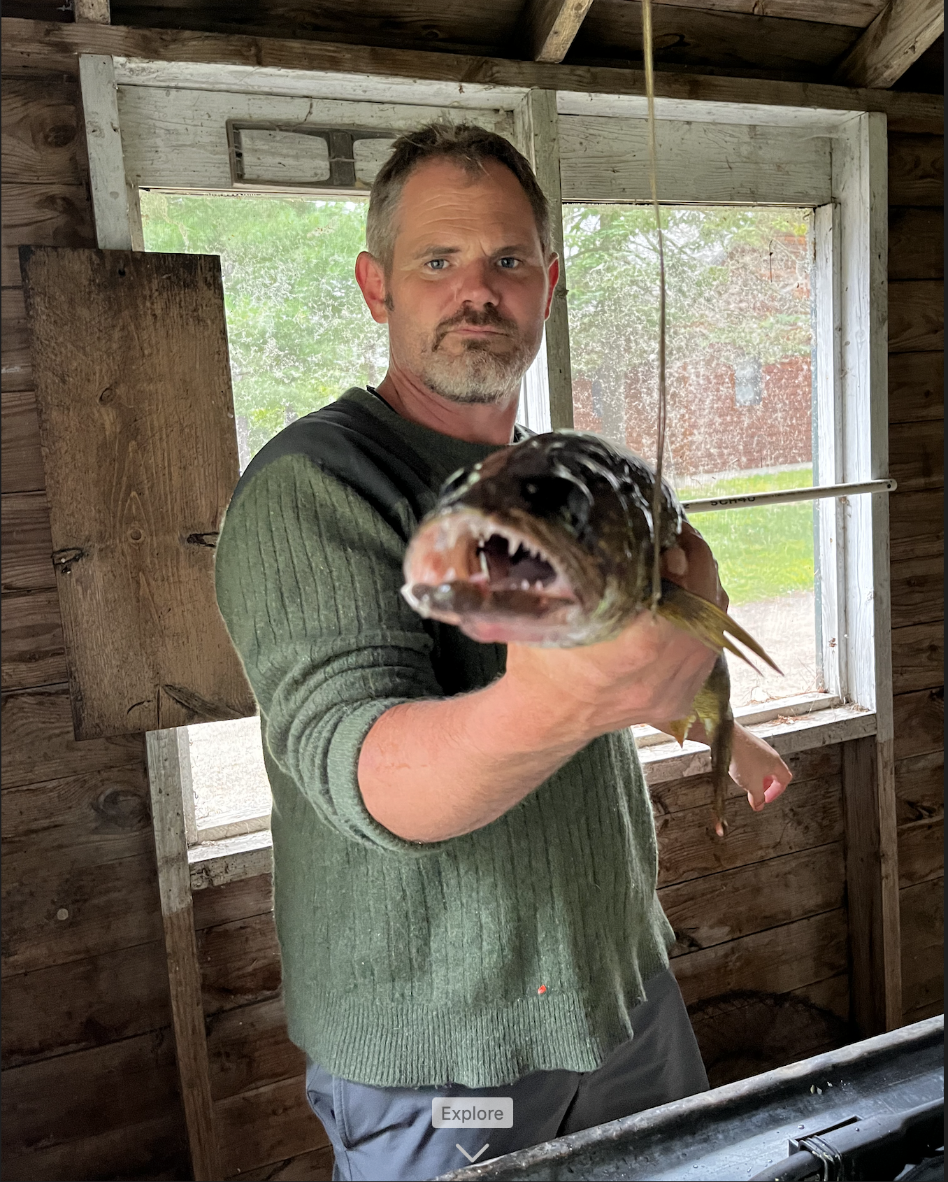 Jon Regenold in his fish house preparing a fresh catch – North Woods Overhead Doors owner, Northern Minnesota.