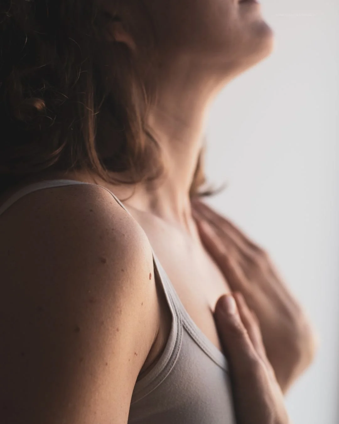 woman in therapy office learning breathing technique for anxiety