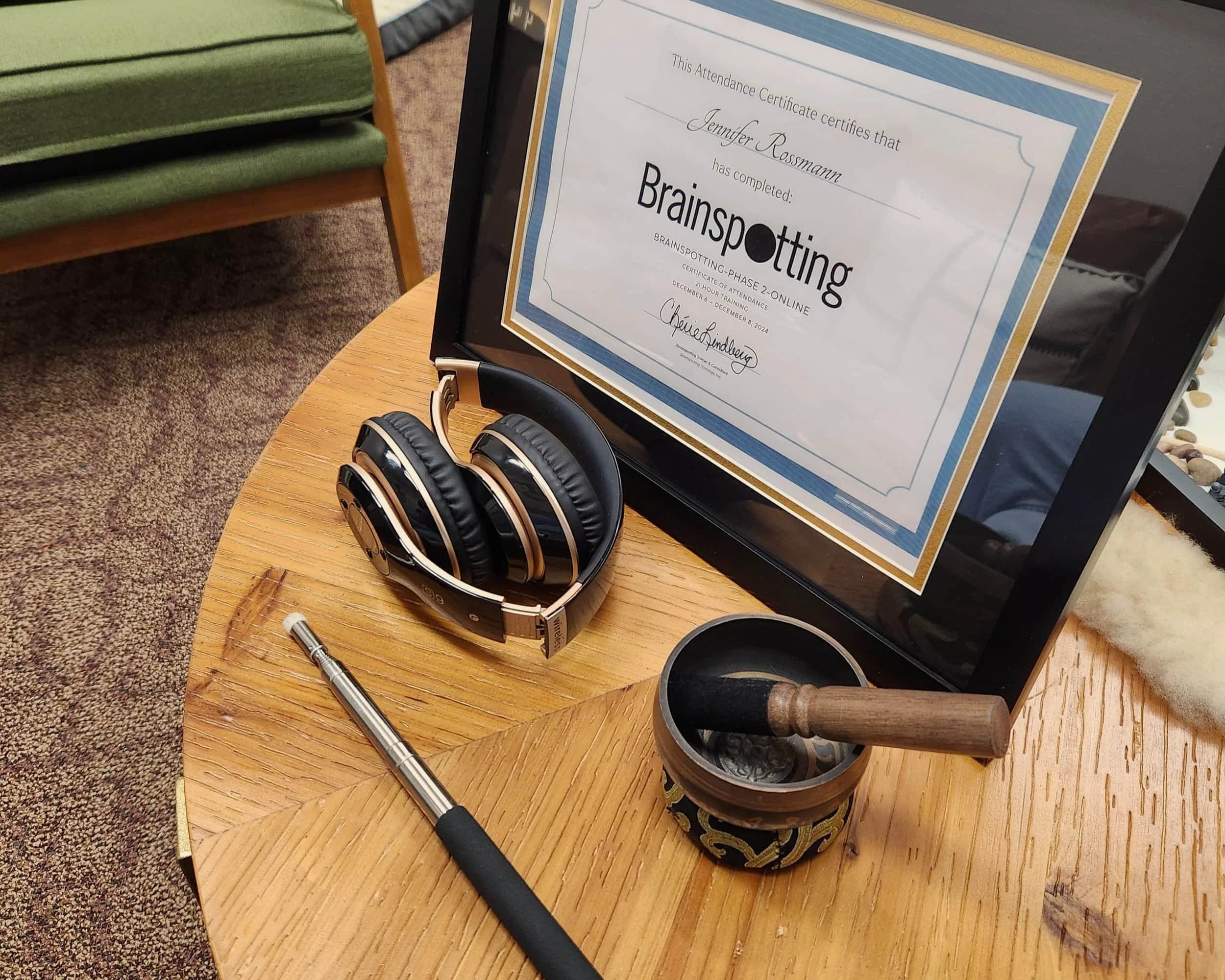 Brainspotting setup in therapy office includes pointer and headphones in Racine