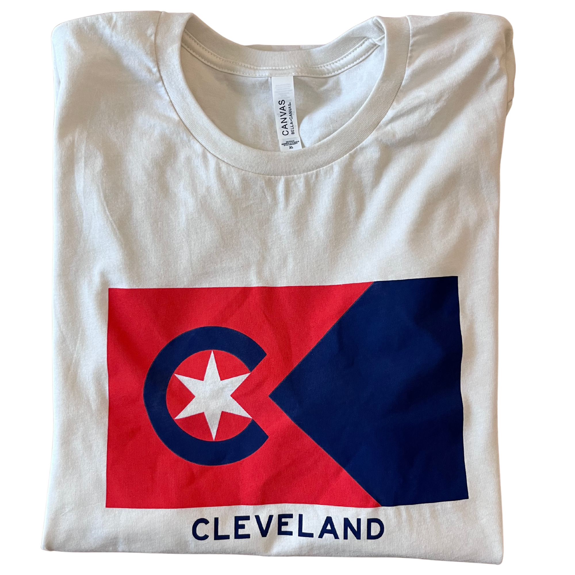 A white T-shirt with a large Peoples Flag of Cleveland-themed flag graphic on the front, featuring a star and a circle, with the word "CLEVELAND" below it.