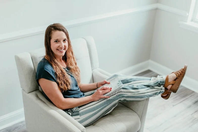 Counselor Becca Morris sitting comfortably in her office chair at Inspired Light Counseling in Augusta, GA.