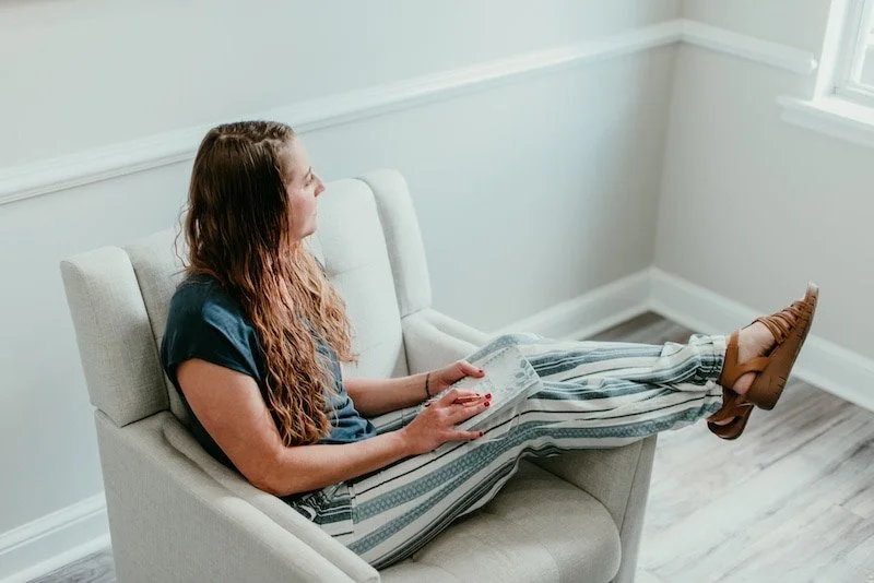 Becca Morris, Counselor and Reiki Master, in Augusta, GA, thoughtfully reflecting on her clients' healing journeys.