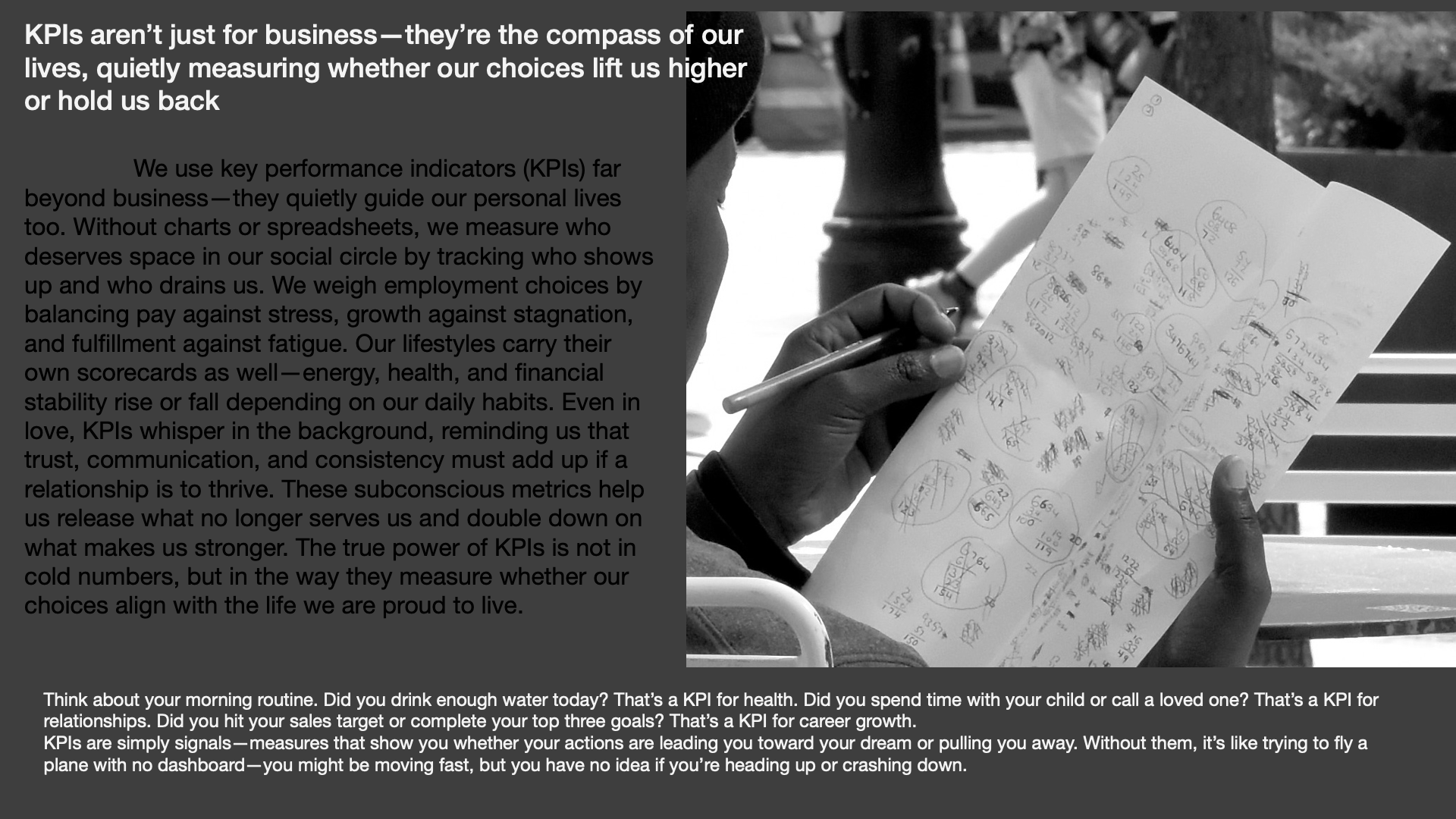 A person holding a sheet of paper filled with handwritten notes and diagrams, with a background of trees and a table in an outdoor setting.