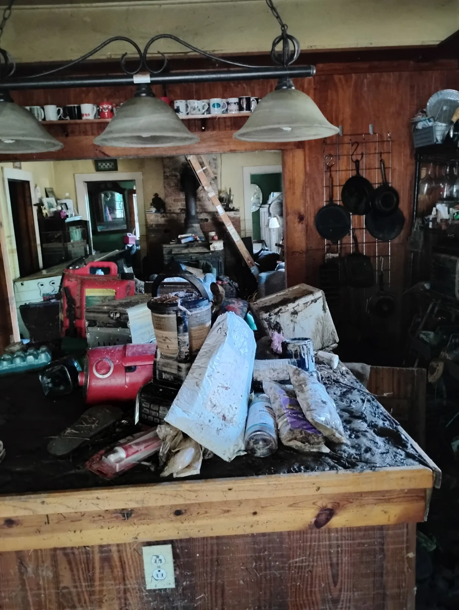 Gloria's belongings after the waters receded and the ladder she climbed to get into the attic with her animals
