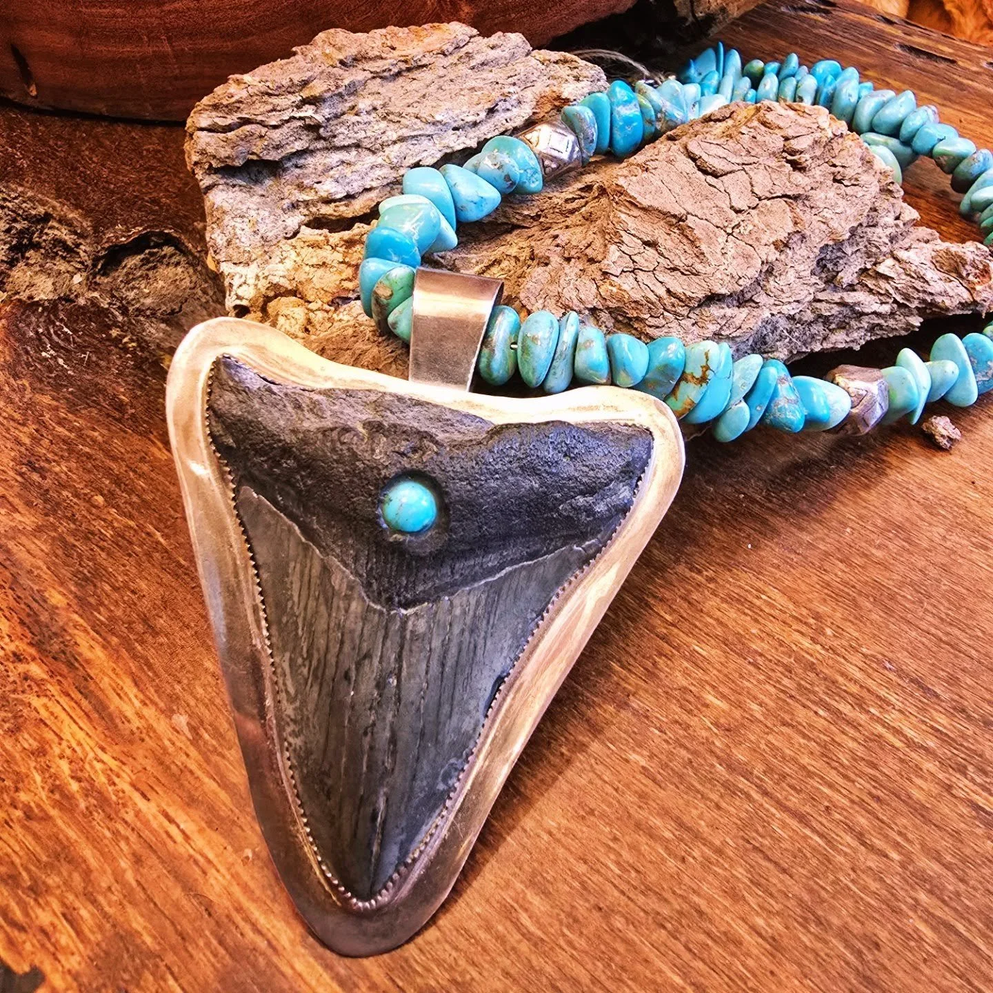 🦈 Premium Fossil Megalodon Shark Tooth with Turquoise Accent

Own a piece of ancient ocean history! This authentic Megalodon shark tooth fossil, millions of years old, has been artistically paired with vibrant turquoise stone &mdash; blending raw pr