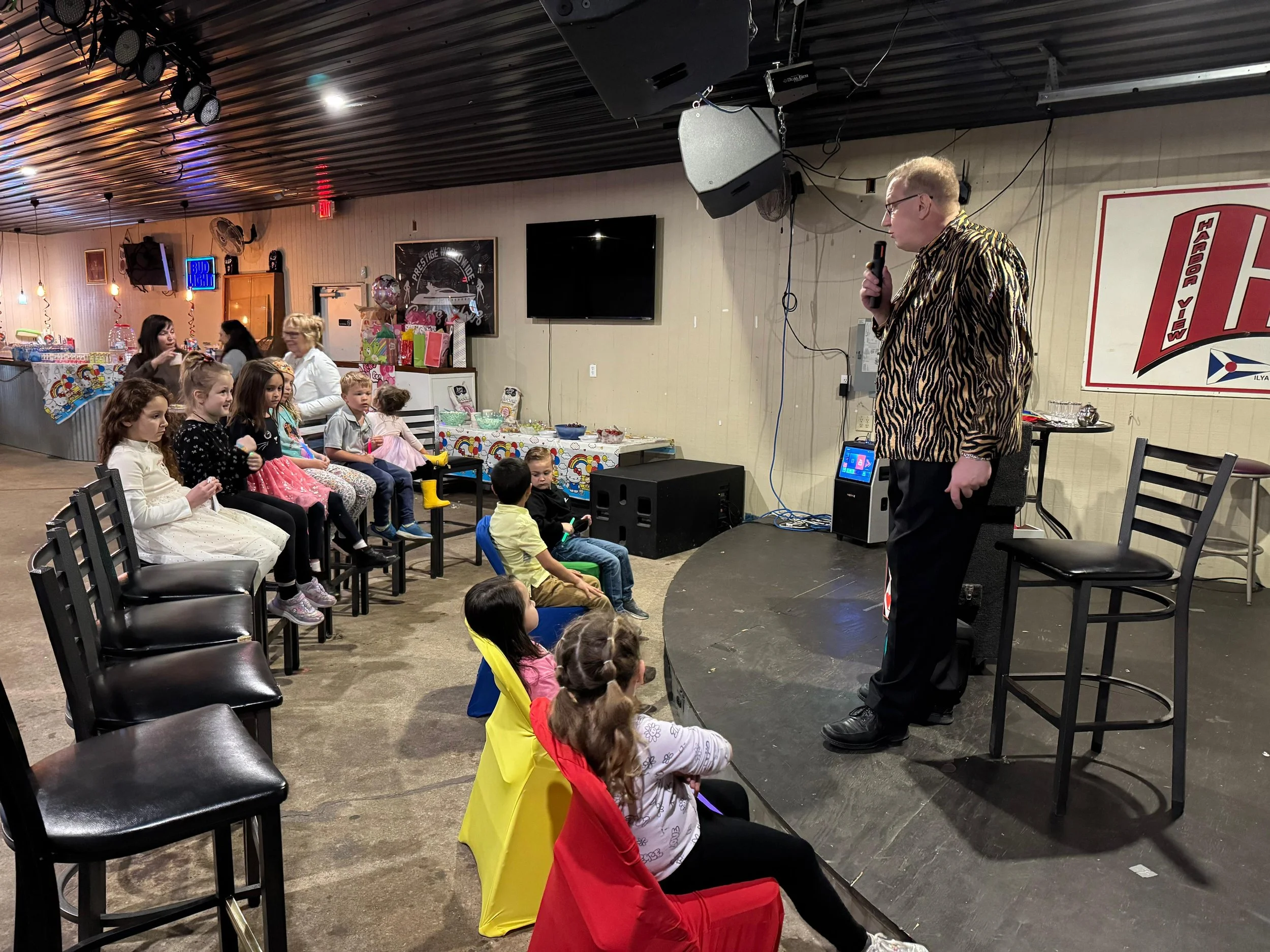 Big Patrick the Magician calling children to come start the Magic show.