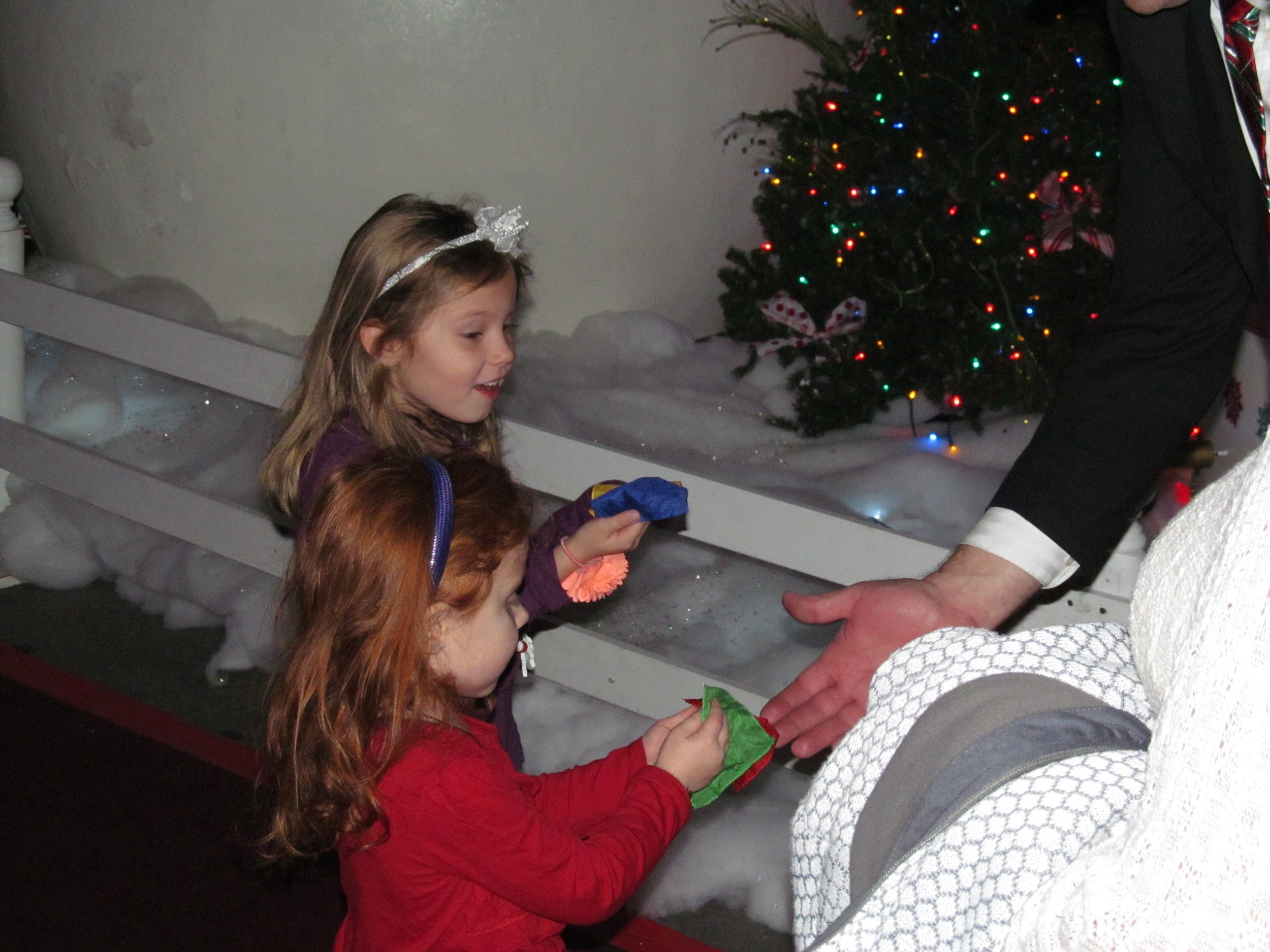 2 little girls enjoying Magician Big Patrick's Close-Up Magic