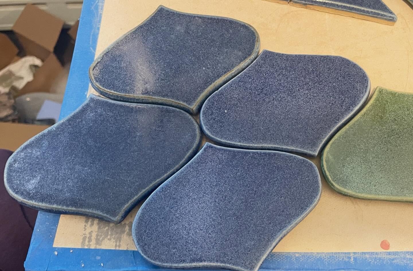 First tests of this blue glaze on a light and dark clay body. I&rsquo;m into it. 💙 Studio update: I have a slab roller and a big commission for a bathroom remodel to work on. 😅🙌#handmadeceramictiles #ceramictile #customceramictiles #studioupdate