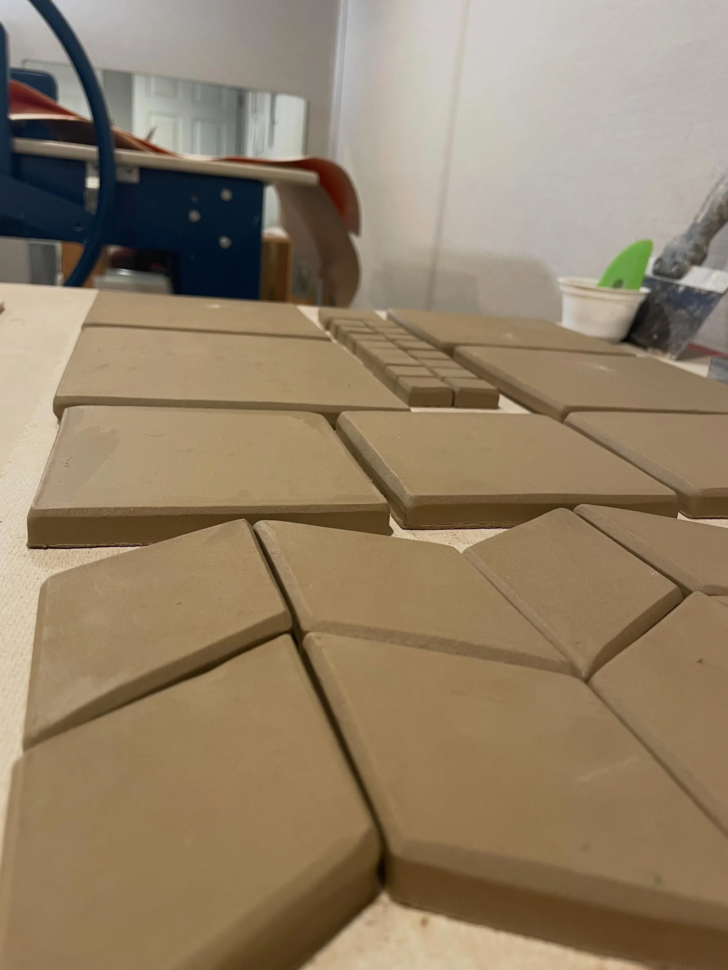 Field tiles for my first big commission since relaunching! Having a slab roller again is SO helpful. Rolling slabs by hand is possible, and I have been doing it recently, but it&rsquo;s not a sustainable use of time and tendons. 😅😆 #tenniselbow #ha