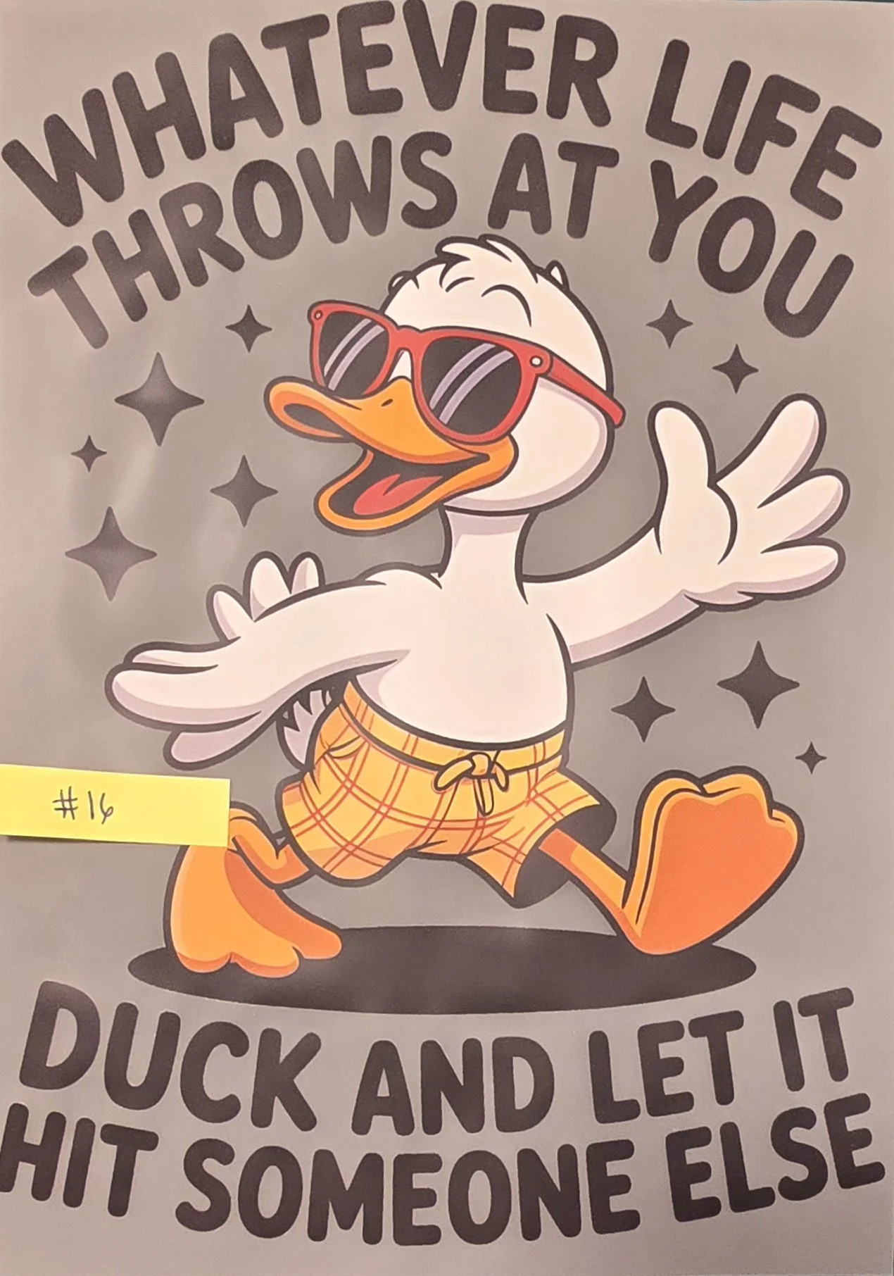 Cartoon duck wearing sunglasses and orange plaid shorts, standing with arms wide open, surrounded by stars, with text above and below that reads, "Whatever life throws at you, duck and let it hit someone else."