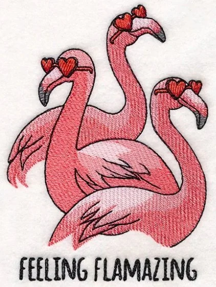 Three pink flamingos wearing red heart-shaped sunglasses with the text 'Feeling Flawesome' below them.