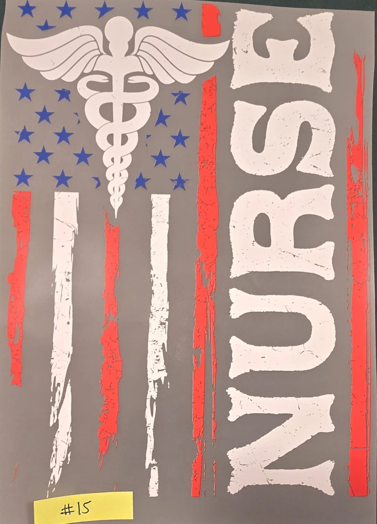Stencil art featuring a caduceus symbol with wings and staff, surrounded by blue stars and red streaks, with the word 'LOVE' painted vertically on a gray background.