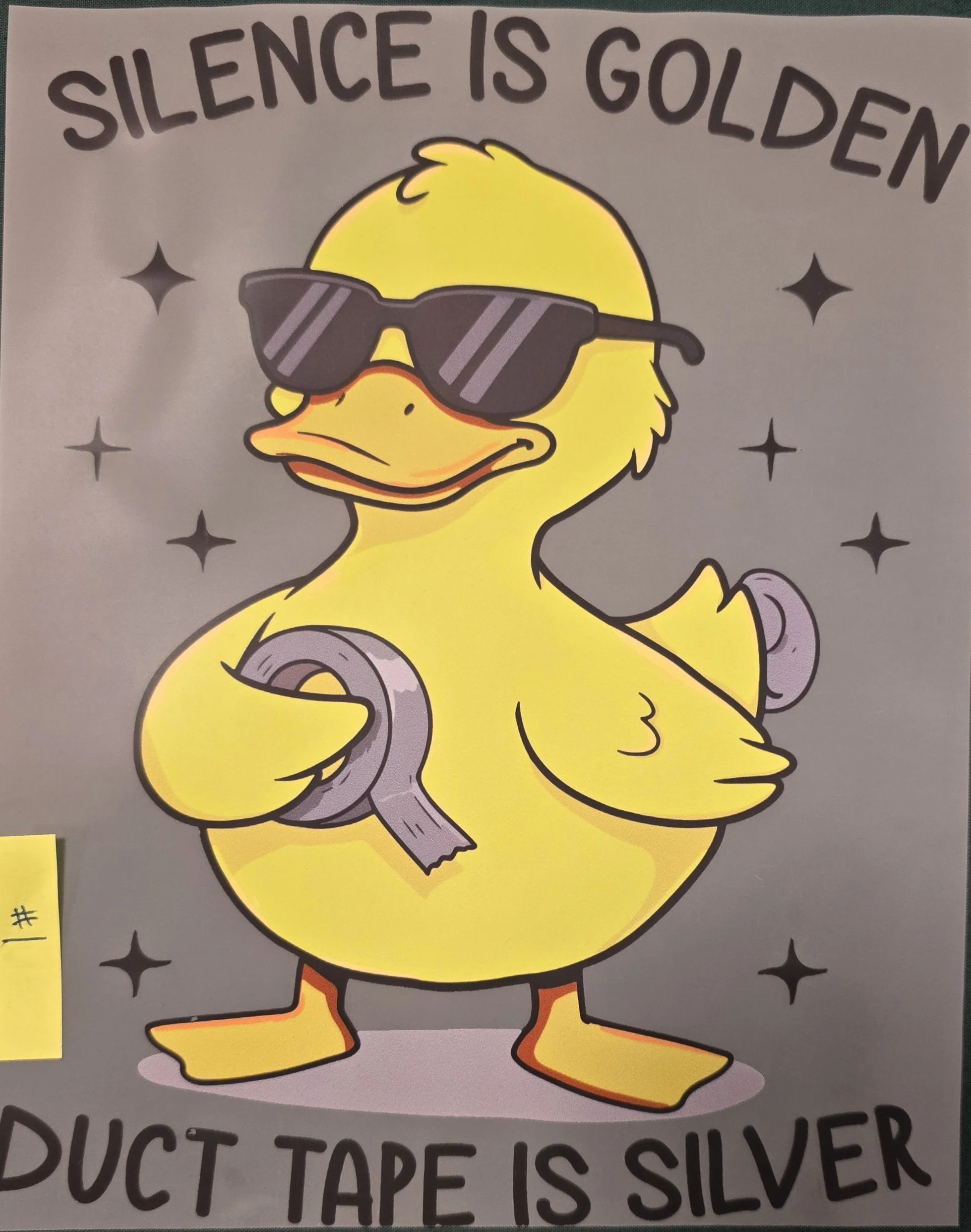 A cartoon duck wearing sunglasses, with the phrase "Silence is golden" above. The duck is flexing a muscular arm, surrounded by small star shapes.