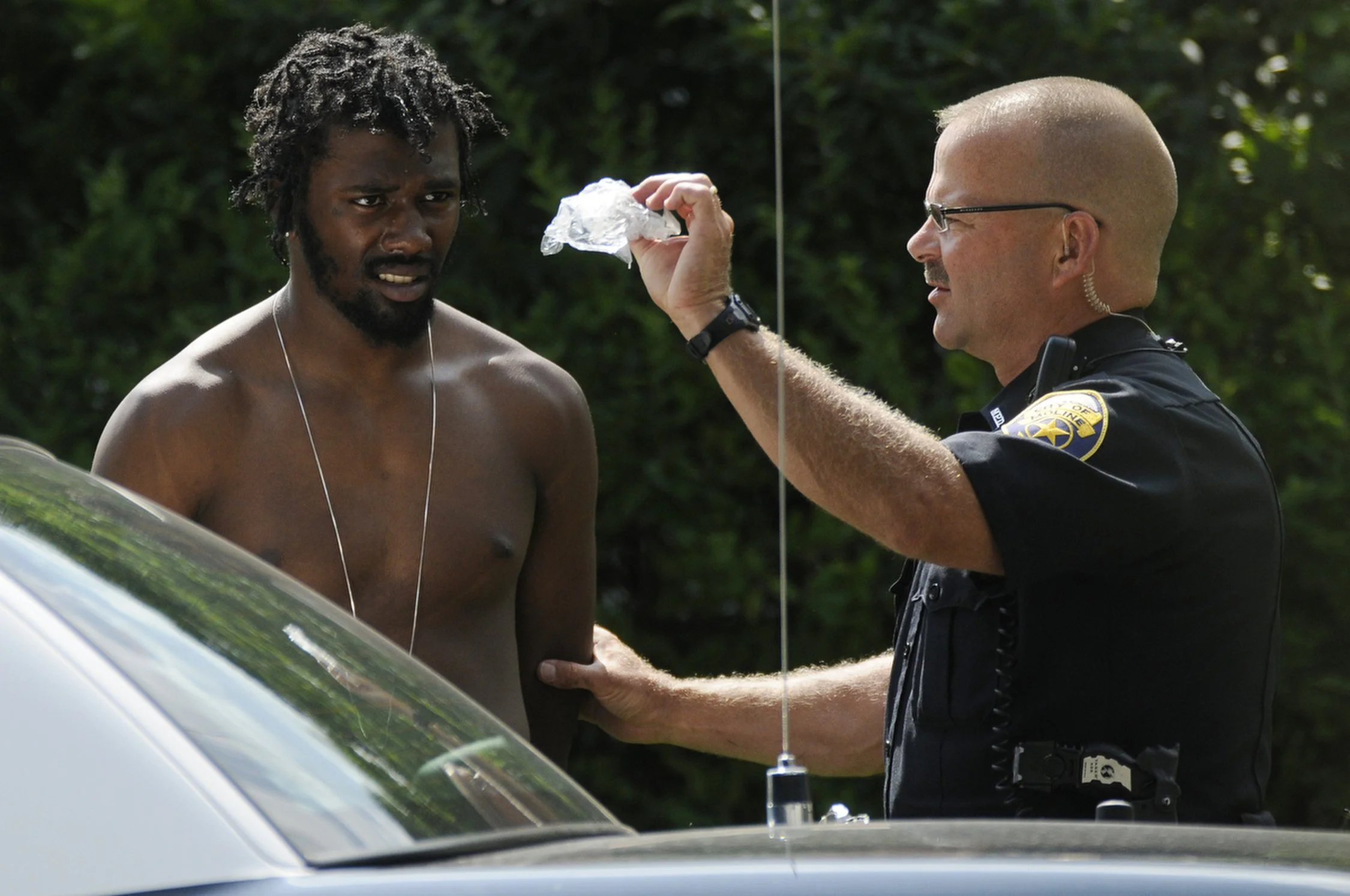 Moline Police take a man who is suspected in several home invasions from earlier in the day into custody Saturday afternoon in the 1800 block of 25th Street in Moline. Residents in the area noticed the man looking in windows and helped direct police 