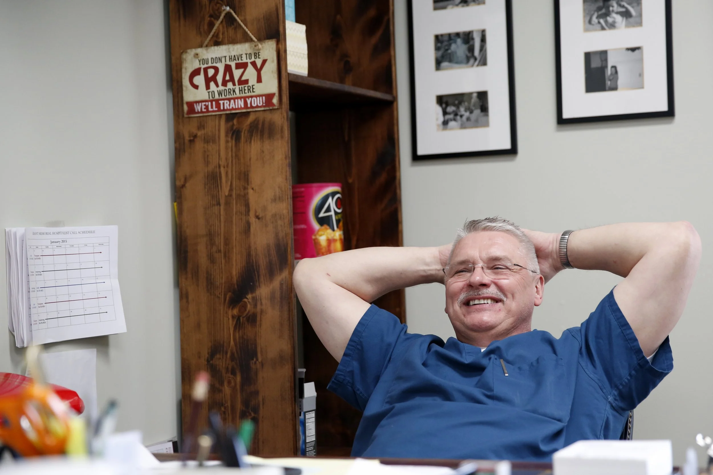 Dr. Hahn has a rare quiet moment in his Petersburg office. His motto is captured in a small sign on the bookcase. "You don’t have to be crazy to work here. We’ll train you!”