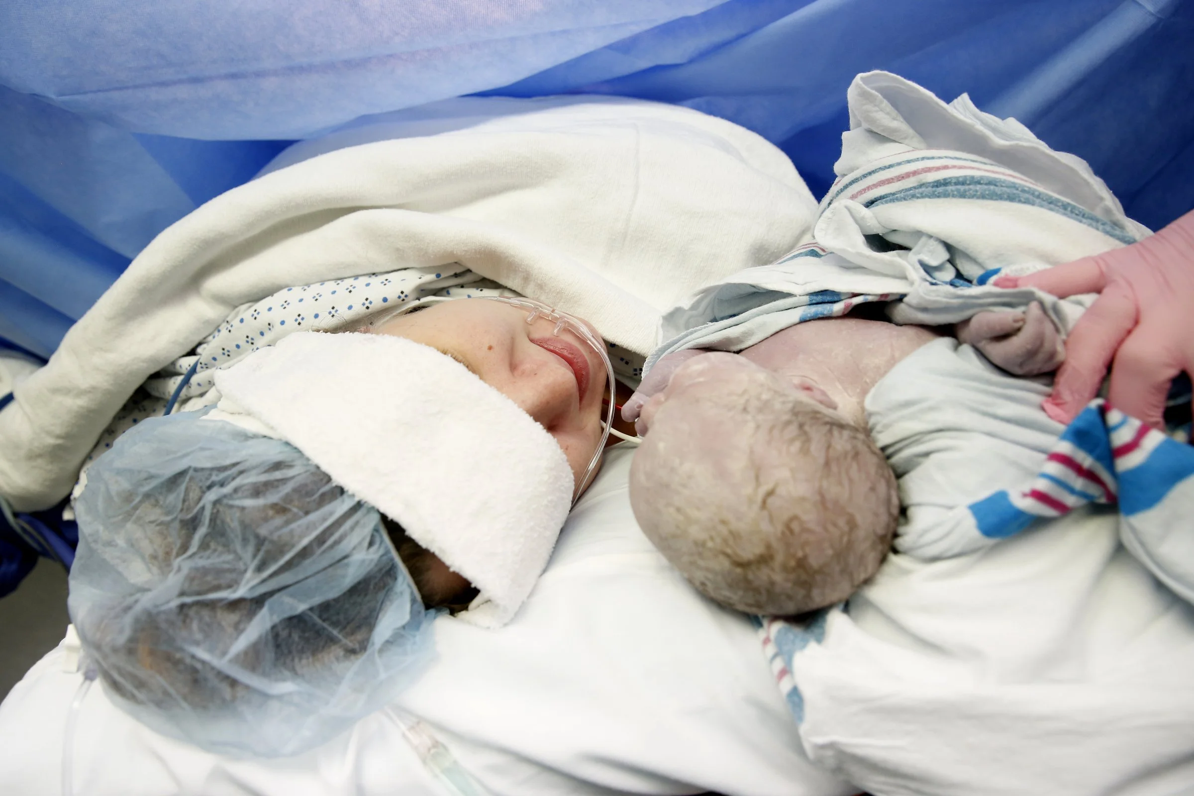 Brittany Walters is shown her baby, Brynleigh Sage after delivering her via Cesarean section.
