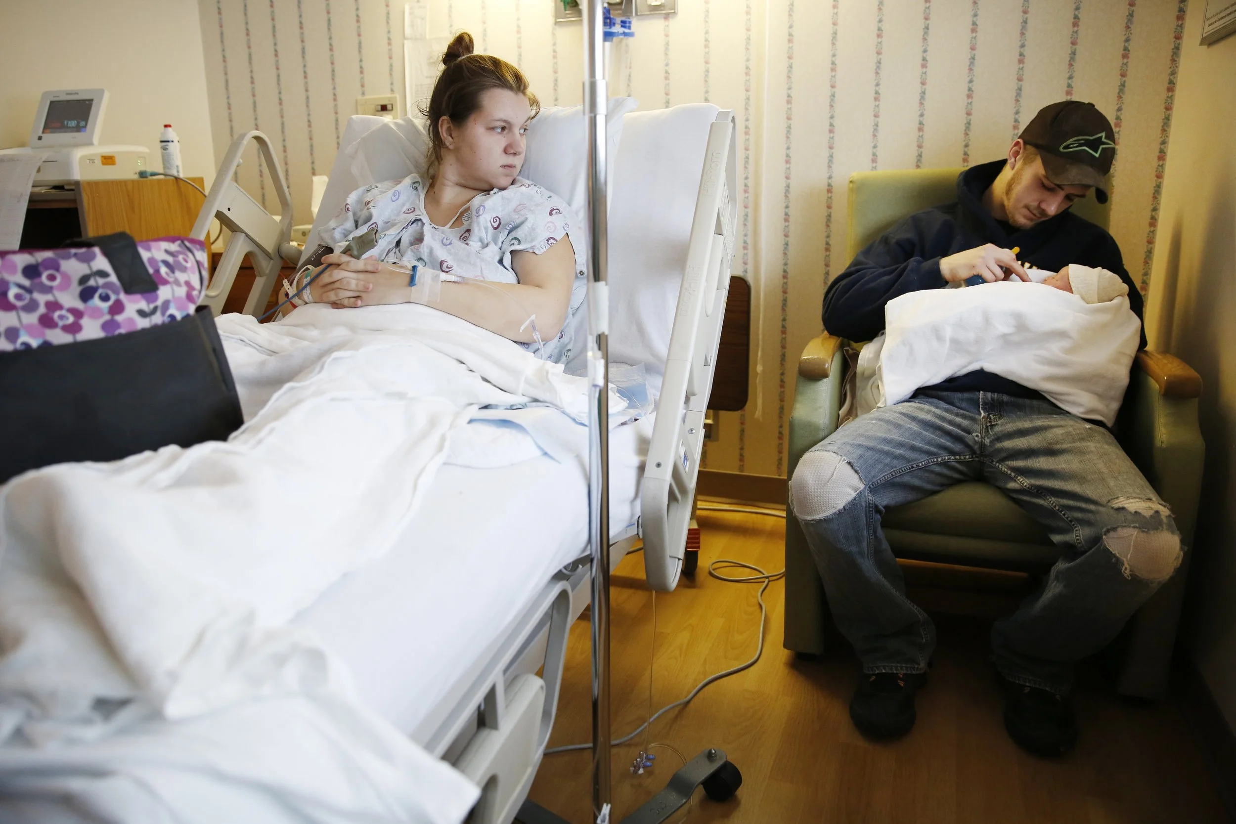 Brittany Walters watches as her ex-boyfriend rocks his daughter, Brynleigh Sage Walters.