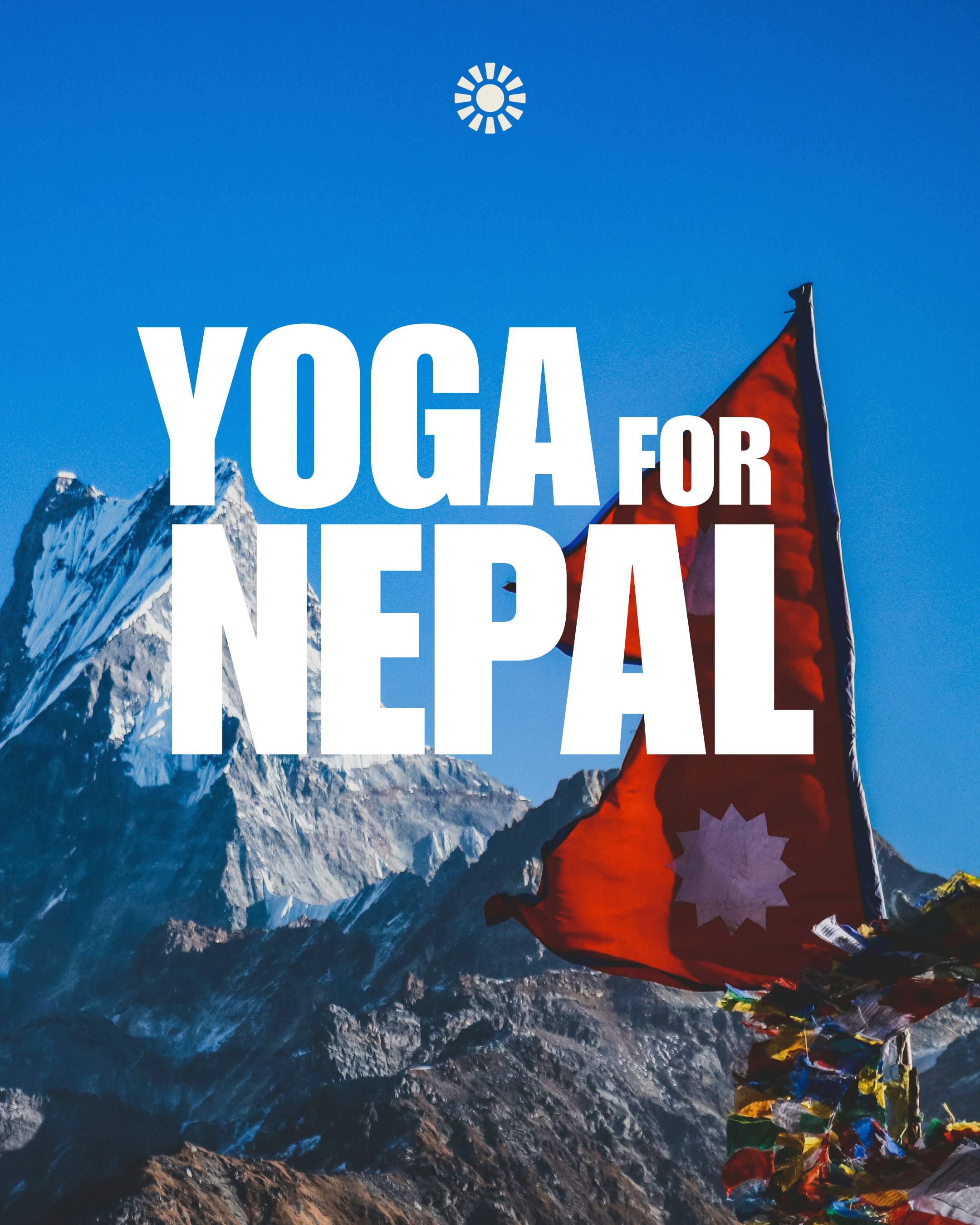 Snow-capped mountain peaks under a clear blue sky with colorful prayer flags in the foreground.