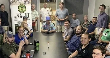 Group of ham radio operators at a group meeting.  Ham radio operators also gather on the radio in events called nets.